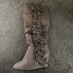 High heeled boots with tassels